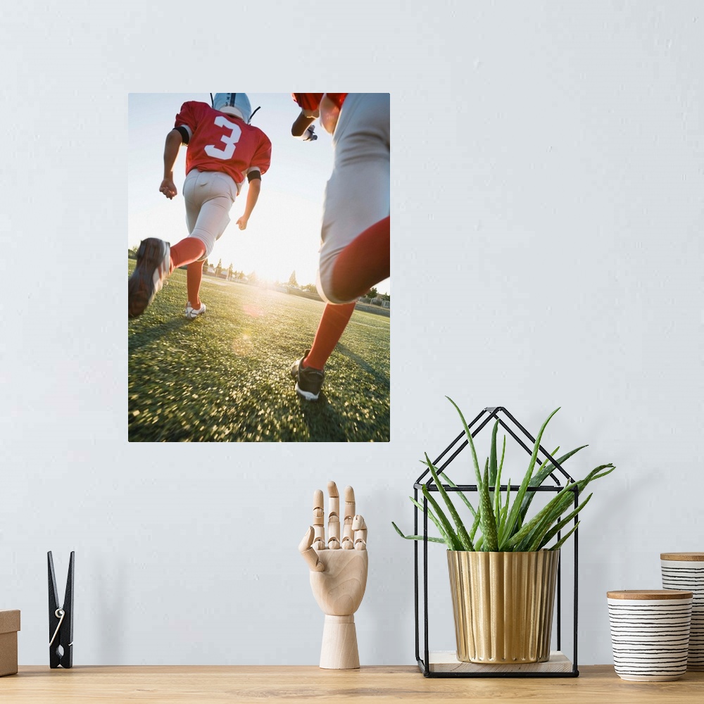A bohemian room featuring Football players running on field
