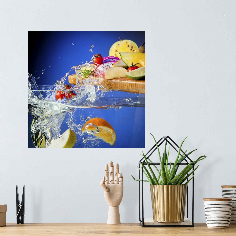 A bohemian room featuring Fresh assorted Fruits on a chopping board splashing in a tank of water
