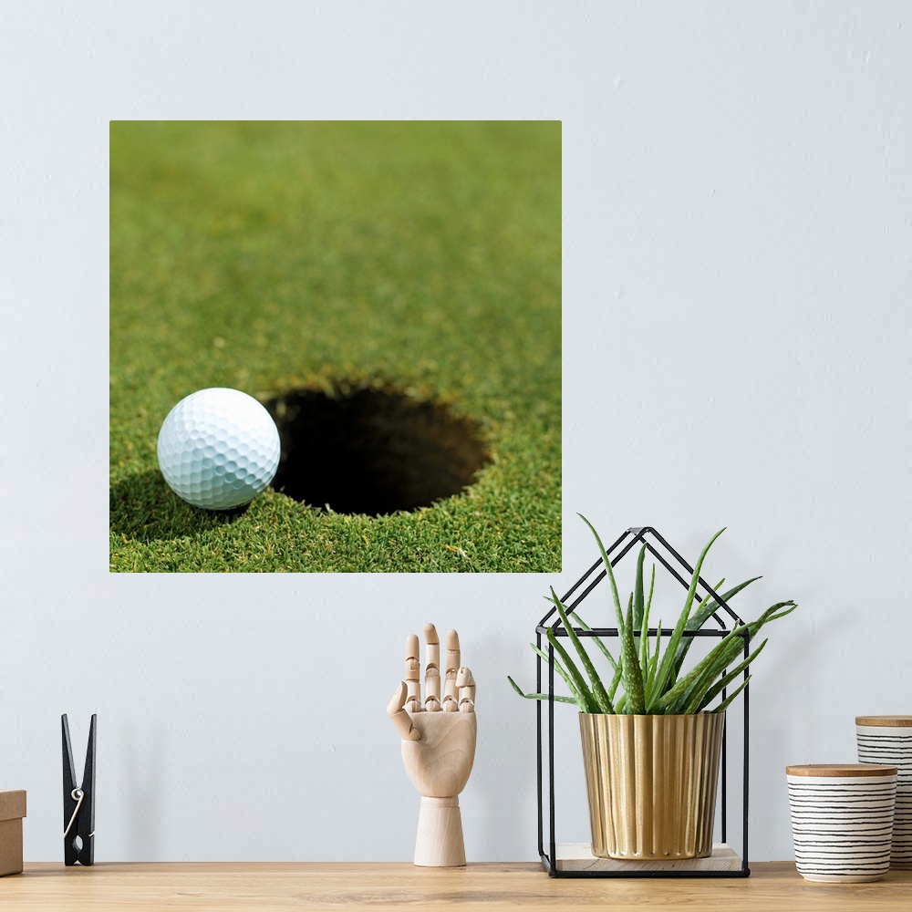 A bohemian room featuring Golf ball on the edge of the hole