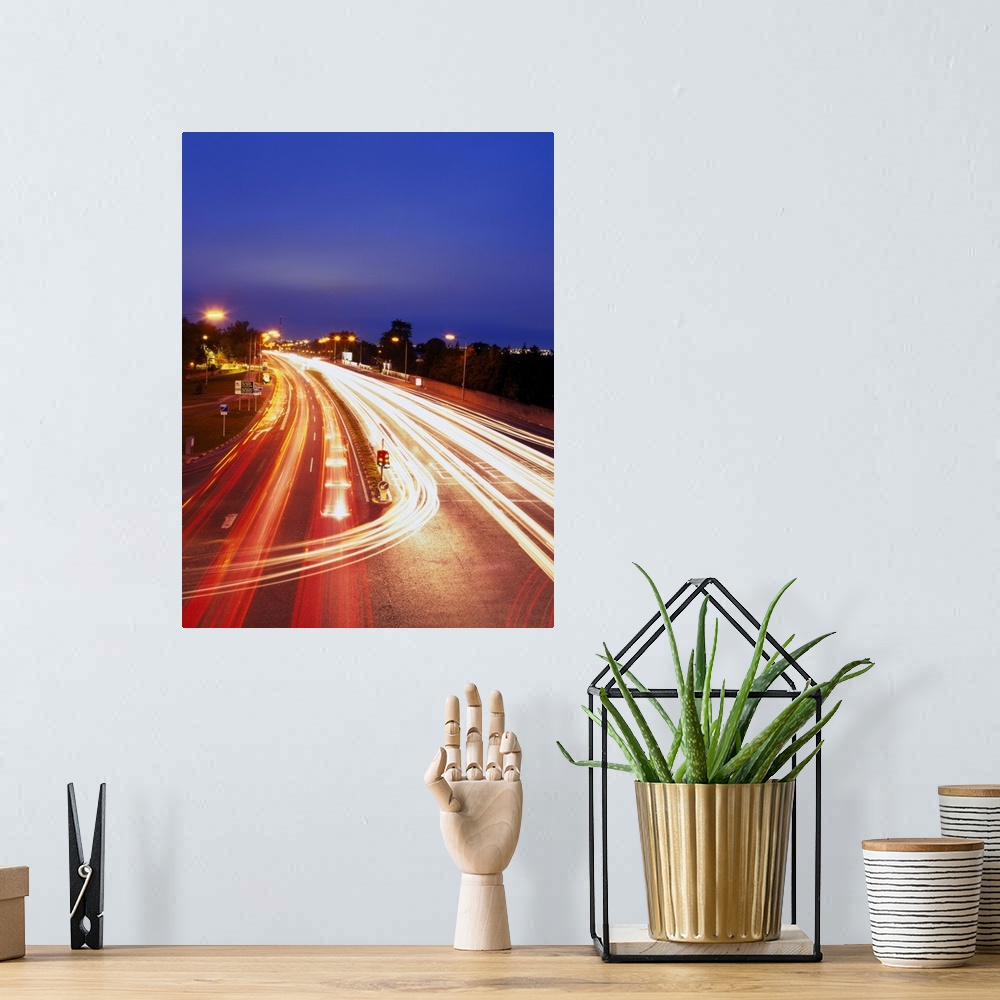 A bohemian room featuring high angle time lapse view of traffic movement on a highway