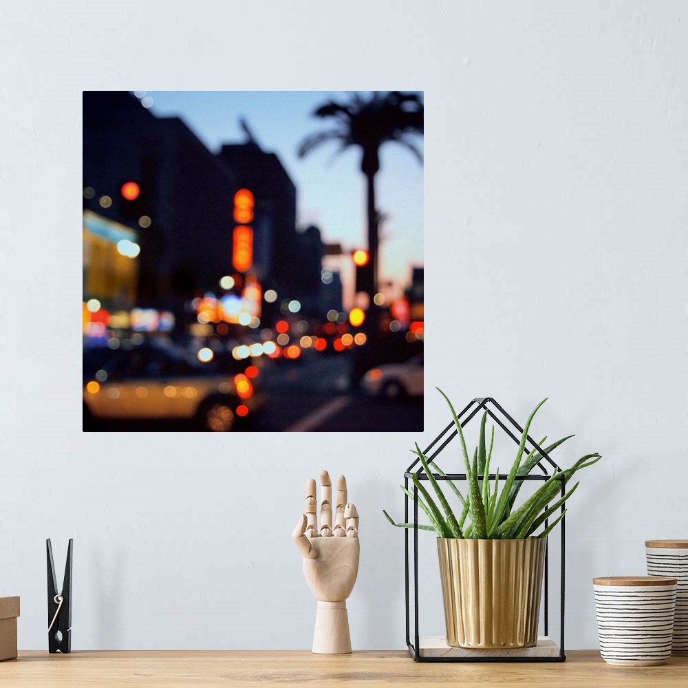 A bohemian room featuring Out of focus image of Hollywood Boulevard at sunset. Bokeh lights, flash cars and palm trees