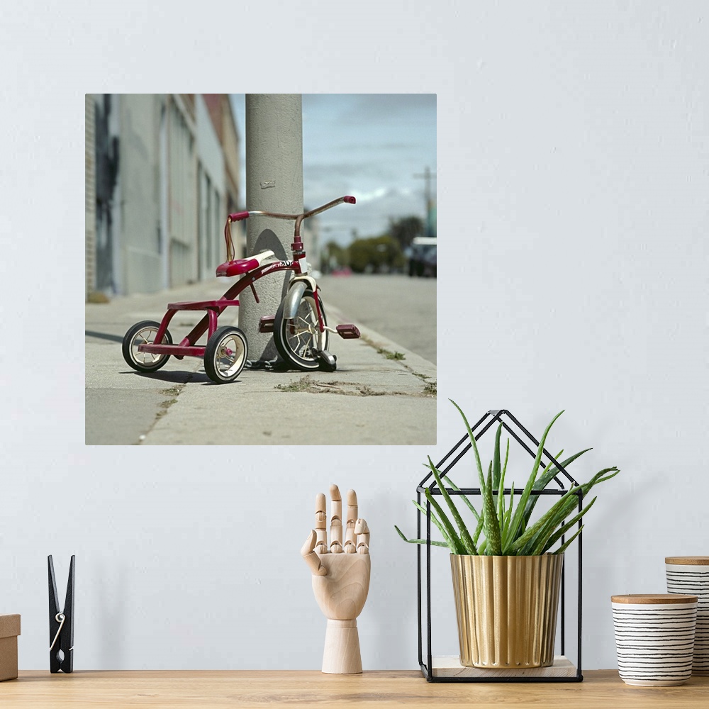 A bohemian room featuring Lovely red tricycle