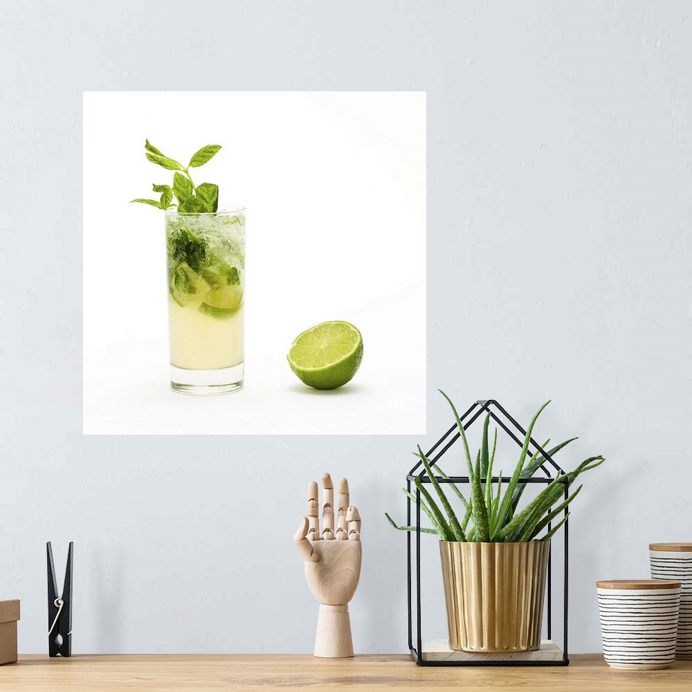 A bohemian room featuring Mojito with fresh mint leaves and lime on crushed ice