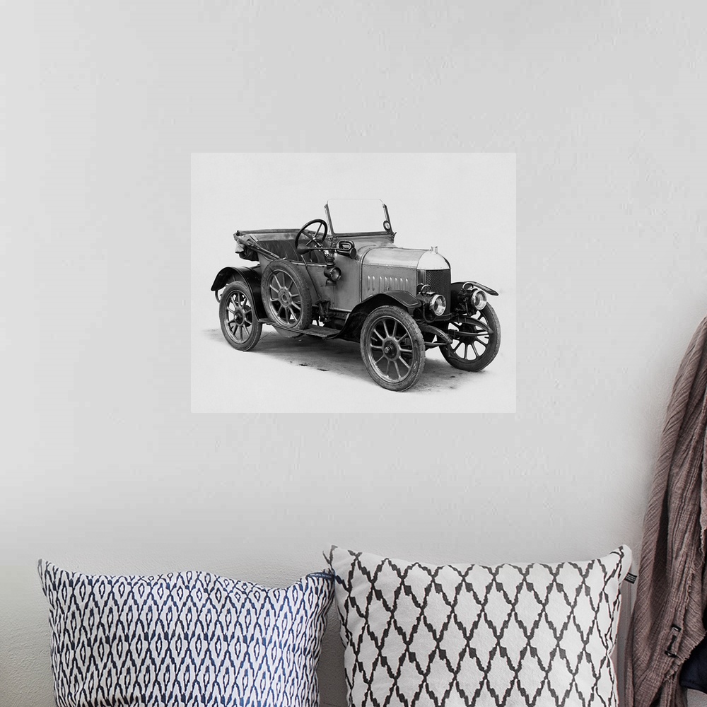 A bohemian room featuring A member of early automobile history: the first Morris Oxford two-seater convertible built in 1913.