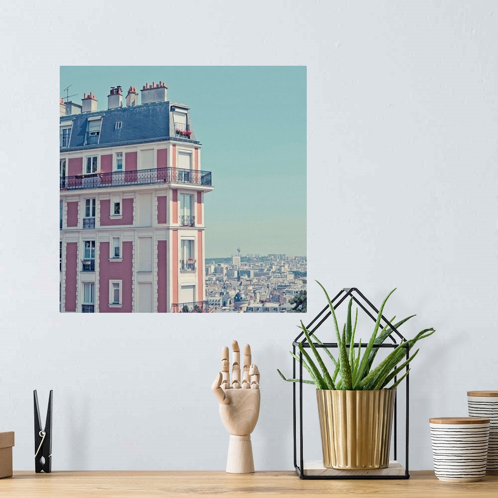 A bohemian room featuring Orange apartment building with view over Paris, Montmartre, Paris, France.