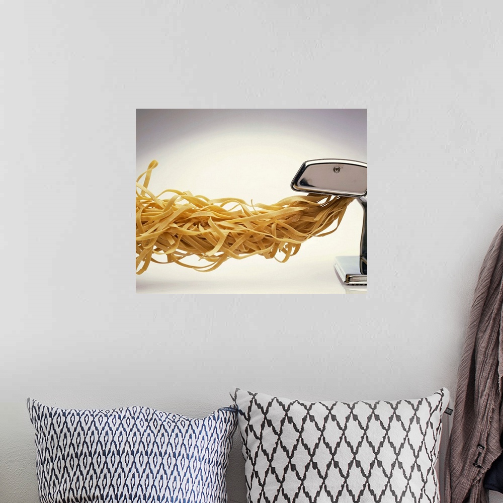 A bohemian room featuring Pasta coming out of pasta machine