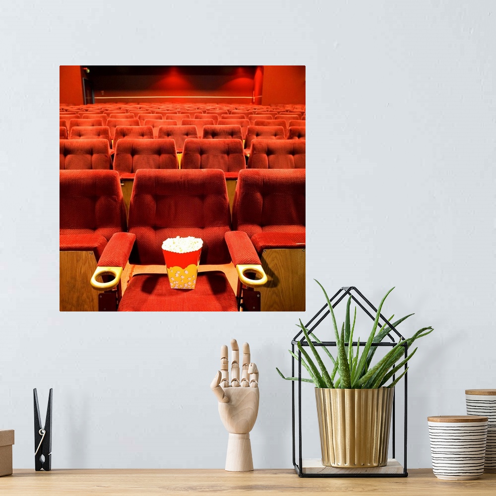 A bohemian room featuring Popcorn on the seat in a cinema