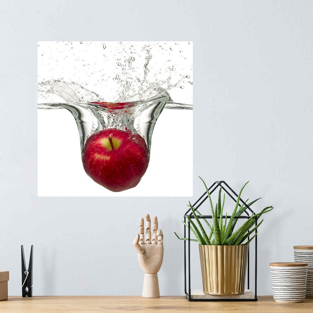 A bohemian room featuring Red apple splashing in water