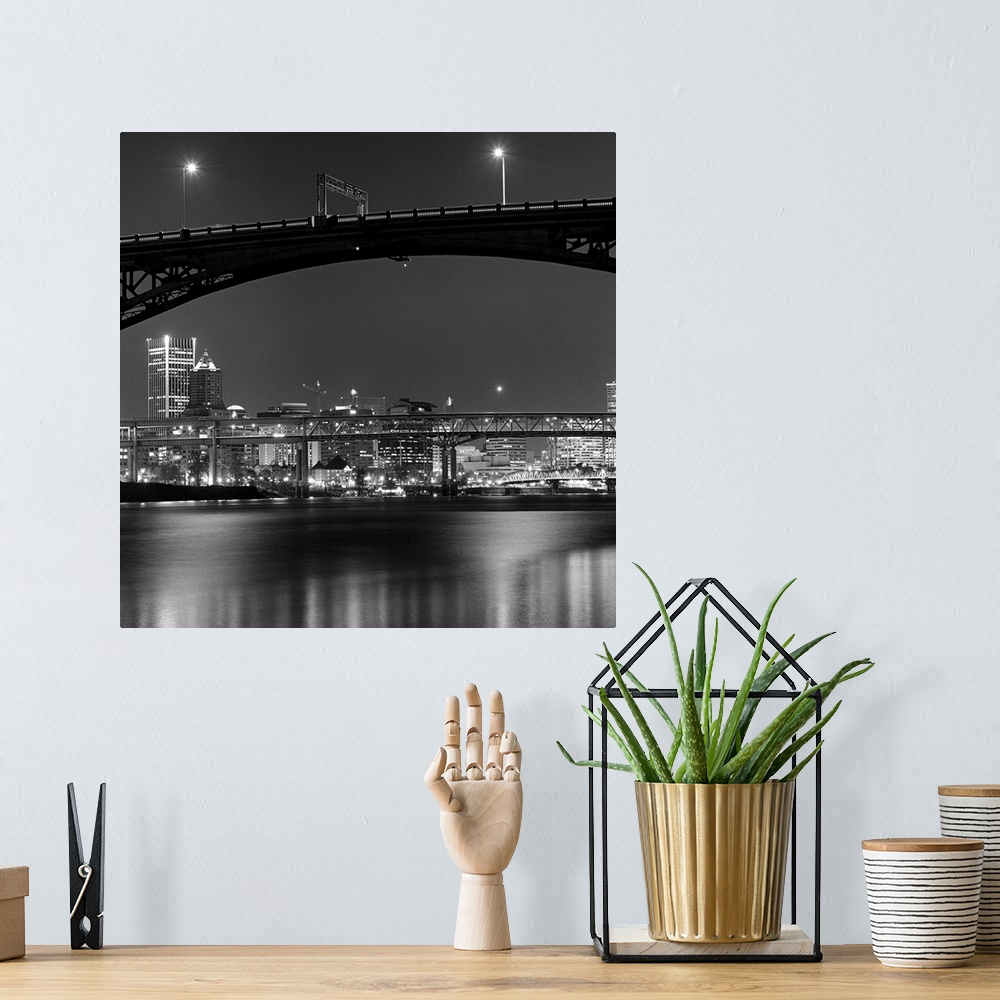 A bohemian room featuring Ross Island bridge at night with city of Portland, Oregon in background, US.