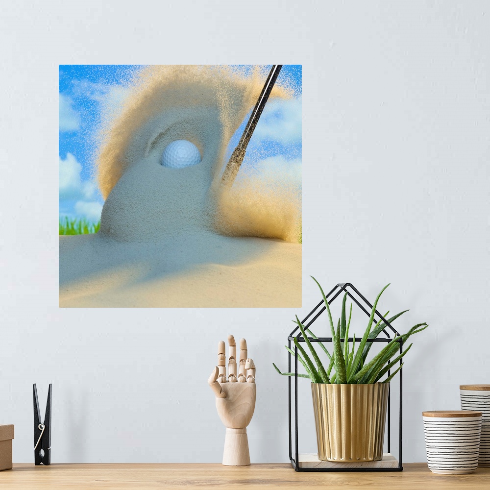 A bohemian room featuring Sand wedge hitting a golf ball out of a sand trap