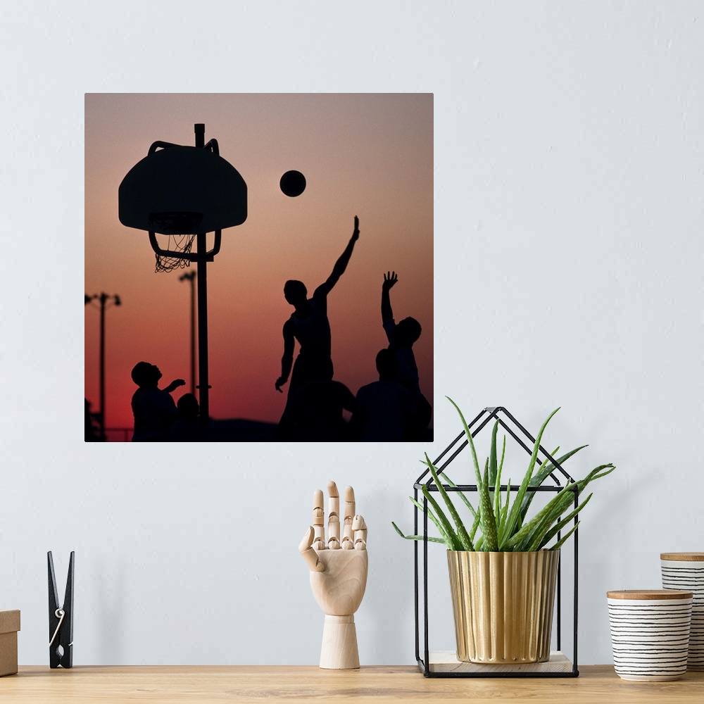 A bohemian room featuring Silhouette of men playing basketball