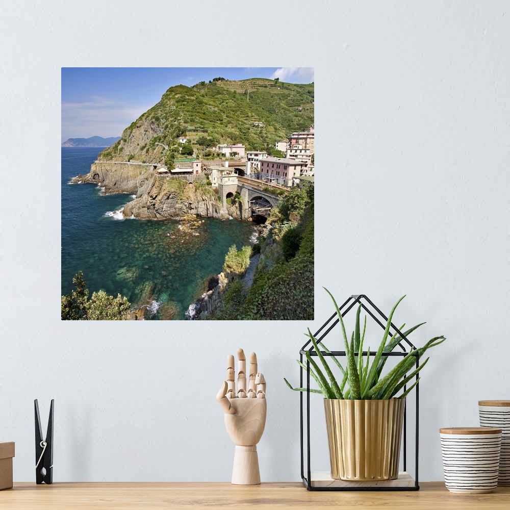 A bohemian room featuring Square crop of railway tunnel in coastal village part of Cinque Terre, Italy.