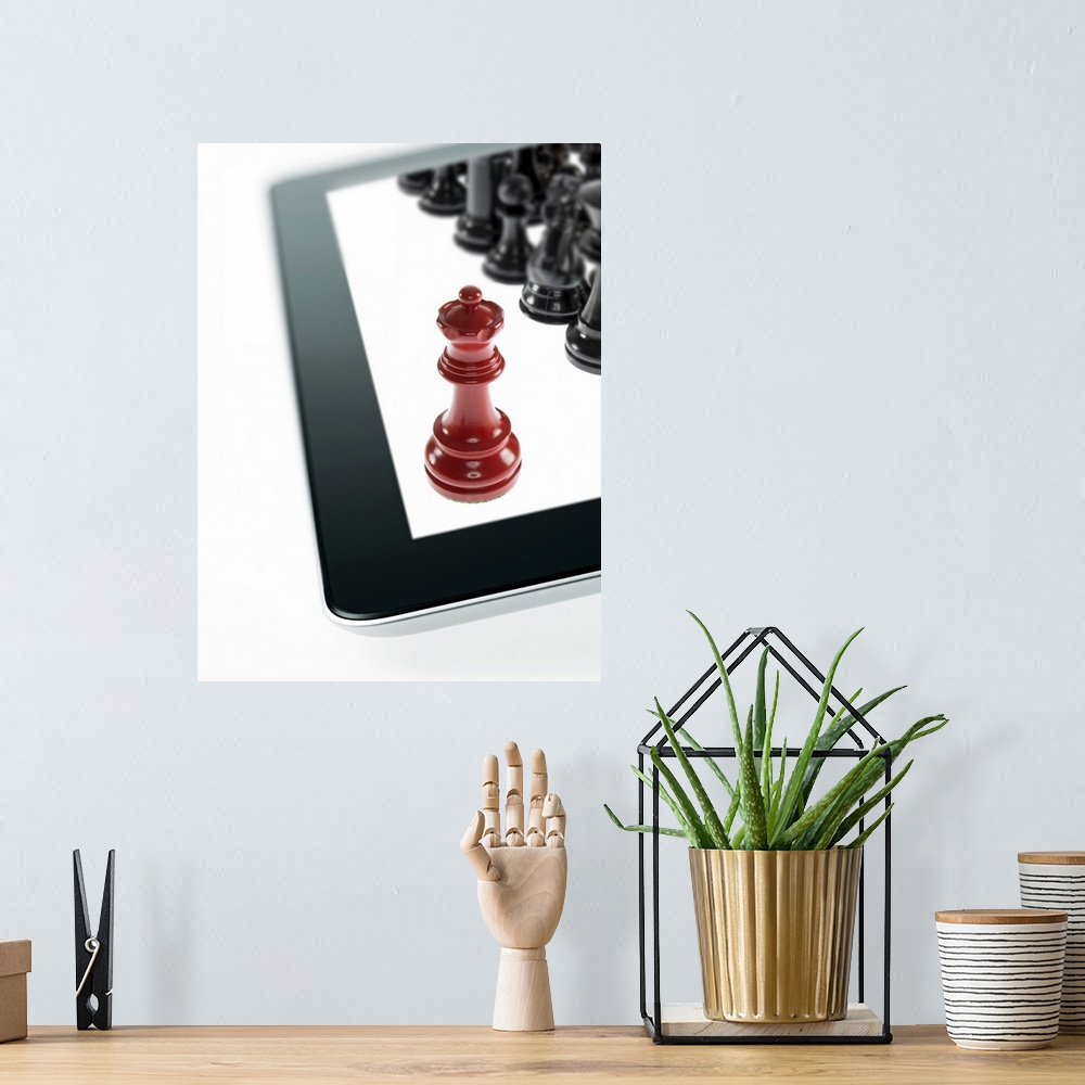 A bohemian room featuring Studio shot of red chess queen and black chess pawns on tablet
