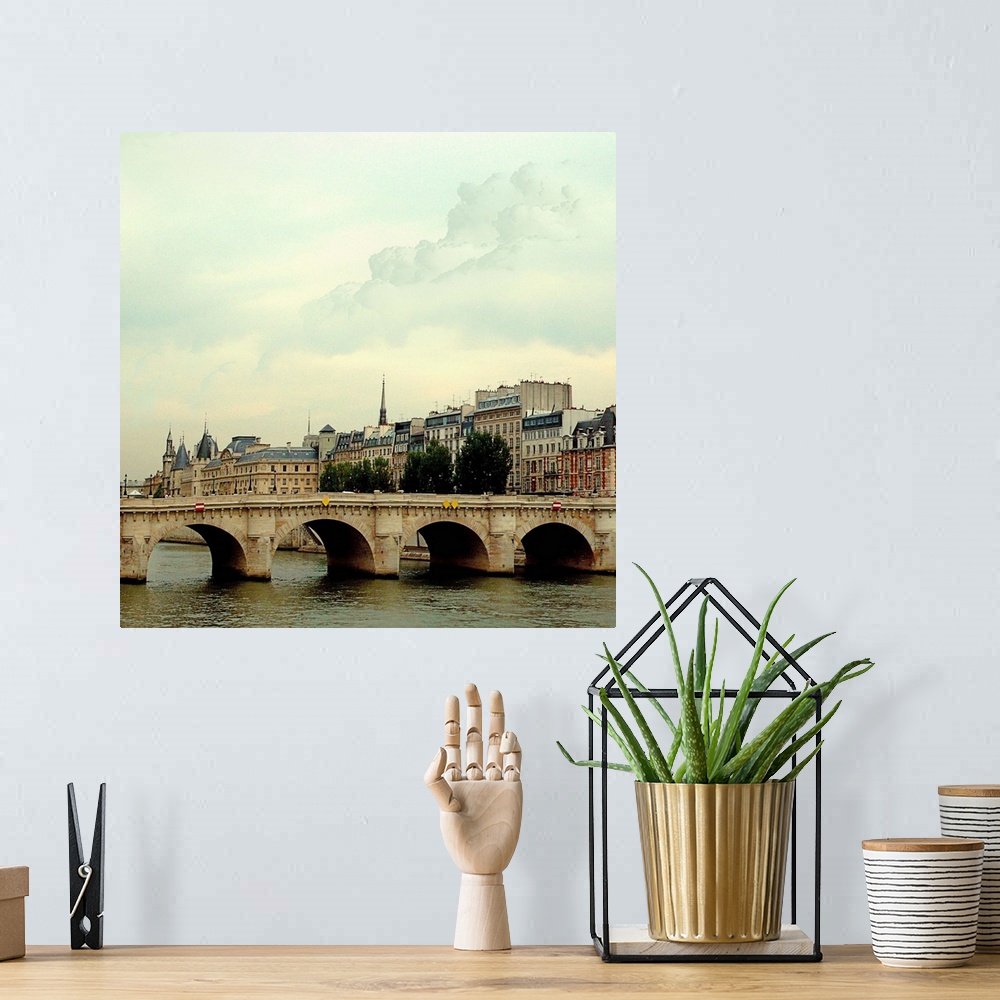 A bohemian room featuring The many bridges crossing the Seine River in Paris France.