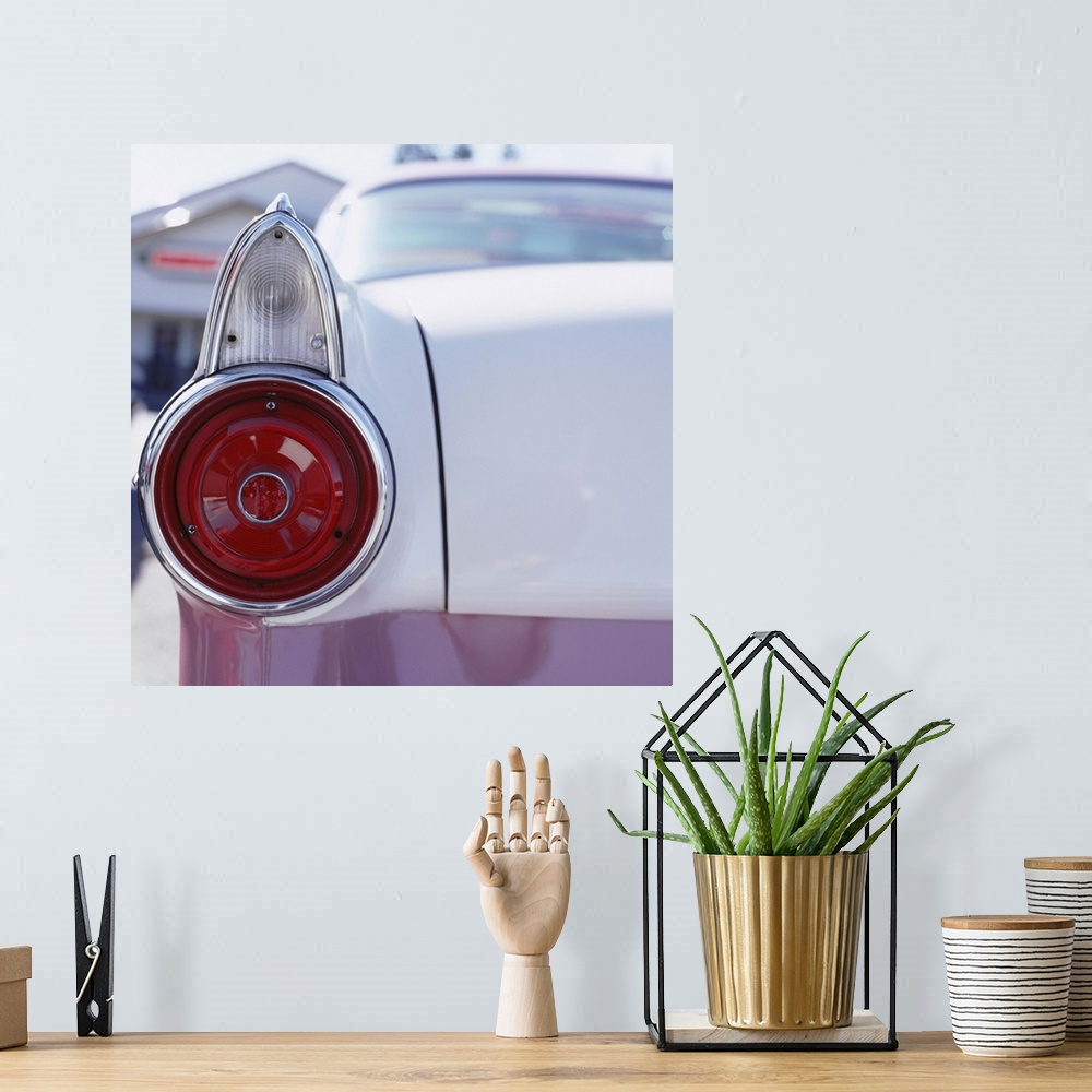 A bohemian room featuring Vintage American car, close-up of rear light and trunk
