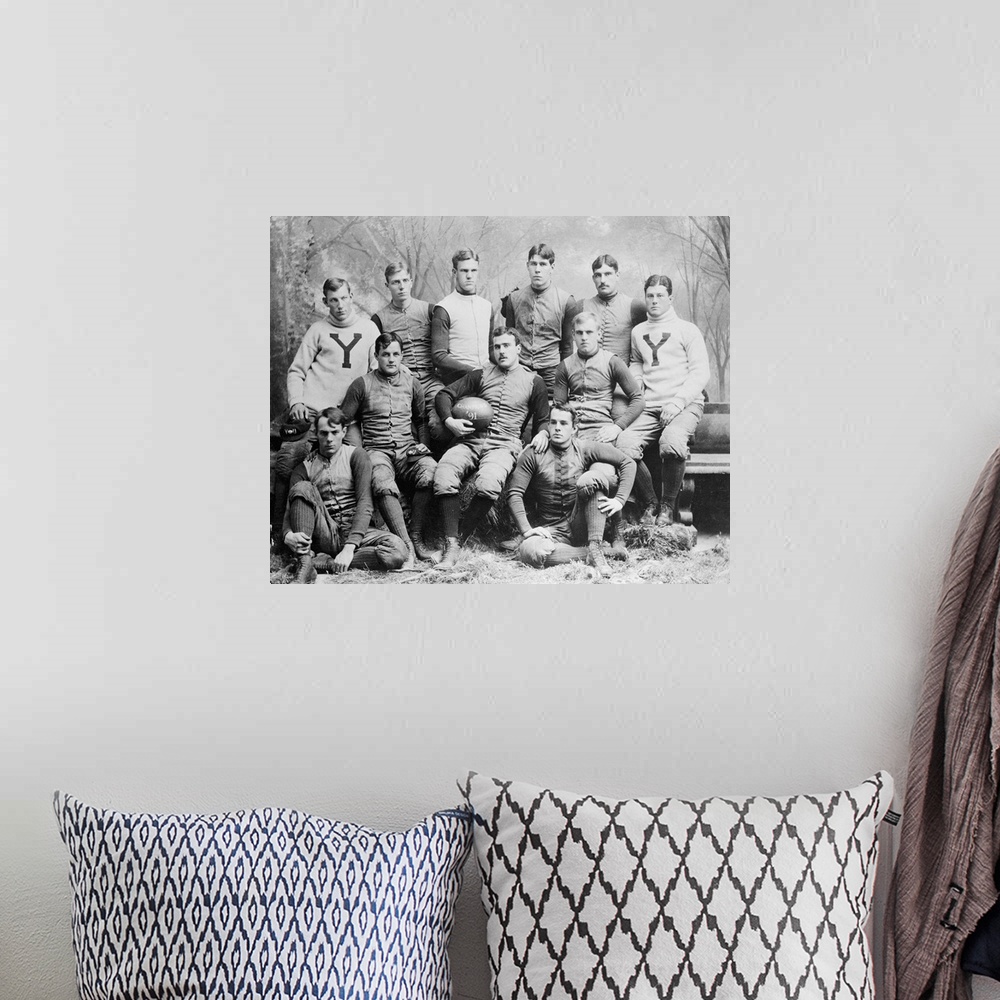 A bohemian room featuring Yale football team of he 1890's in typical pose.