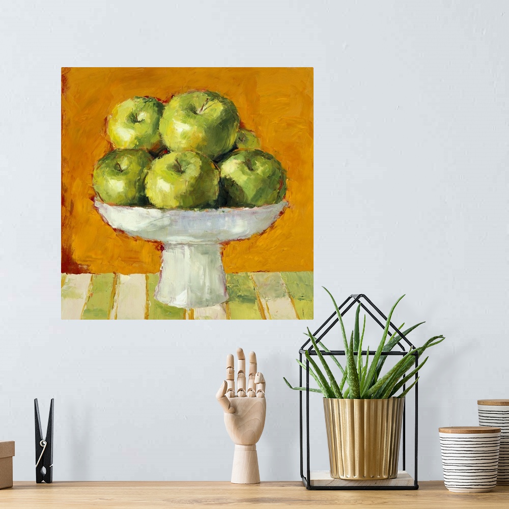 A bohemian room featuring Still life painting of a bowl of green apples.