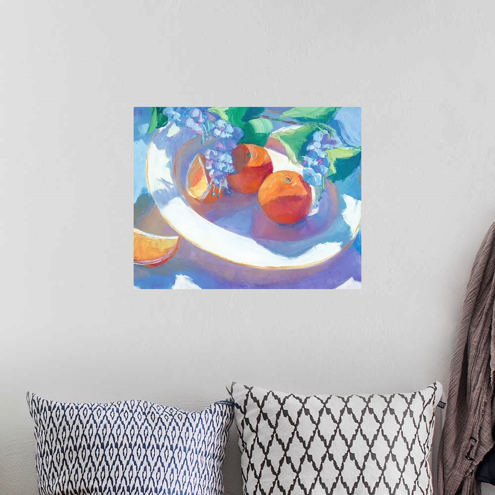 A bohemian room featuring A contemporary still-life painting of fruit on a plate.