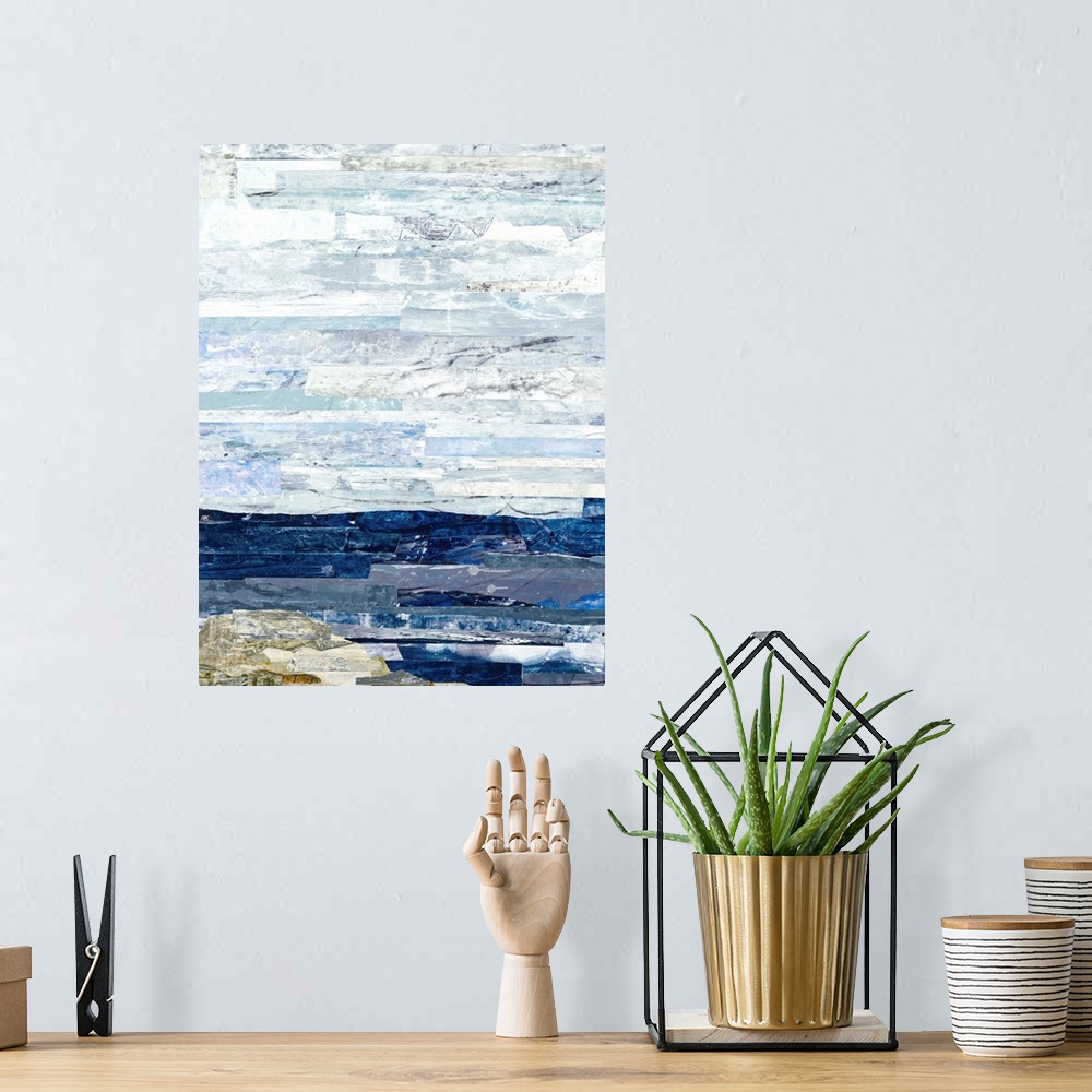 A bohemian room featuring Abstract art with strips of color pasted together to create a landscape with deep blue water, a n...