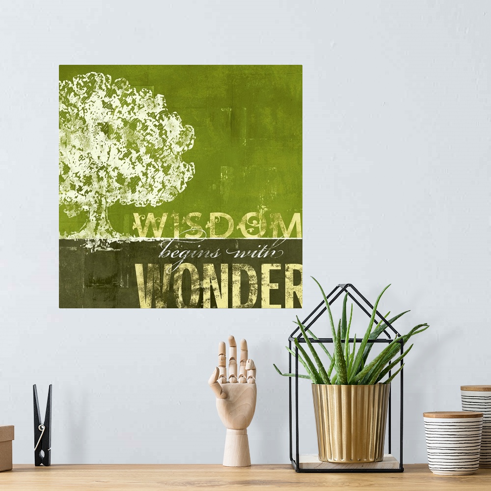 A bohemian room featuring A motivational poster with a sponge like painting of a large oak tree with earthy tones as the sk...