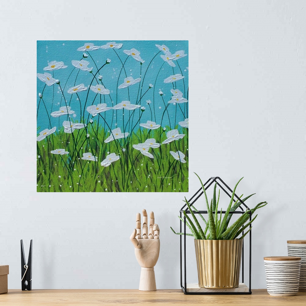 A bohemian room featuring Square painting of white flowers with long, thin stems in tall grass with a blue sky in the backg...