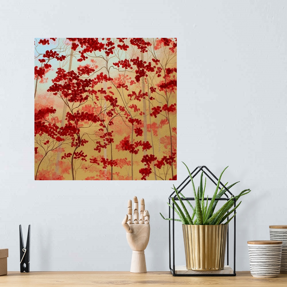 A bohemian room featuring Painting of bold red trees on a golden background.