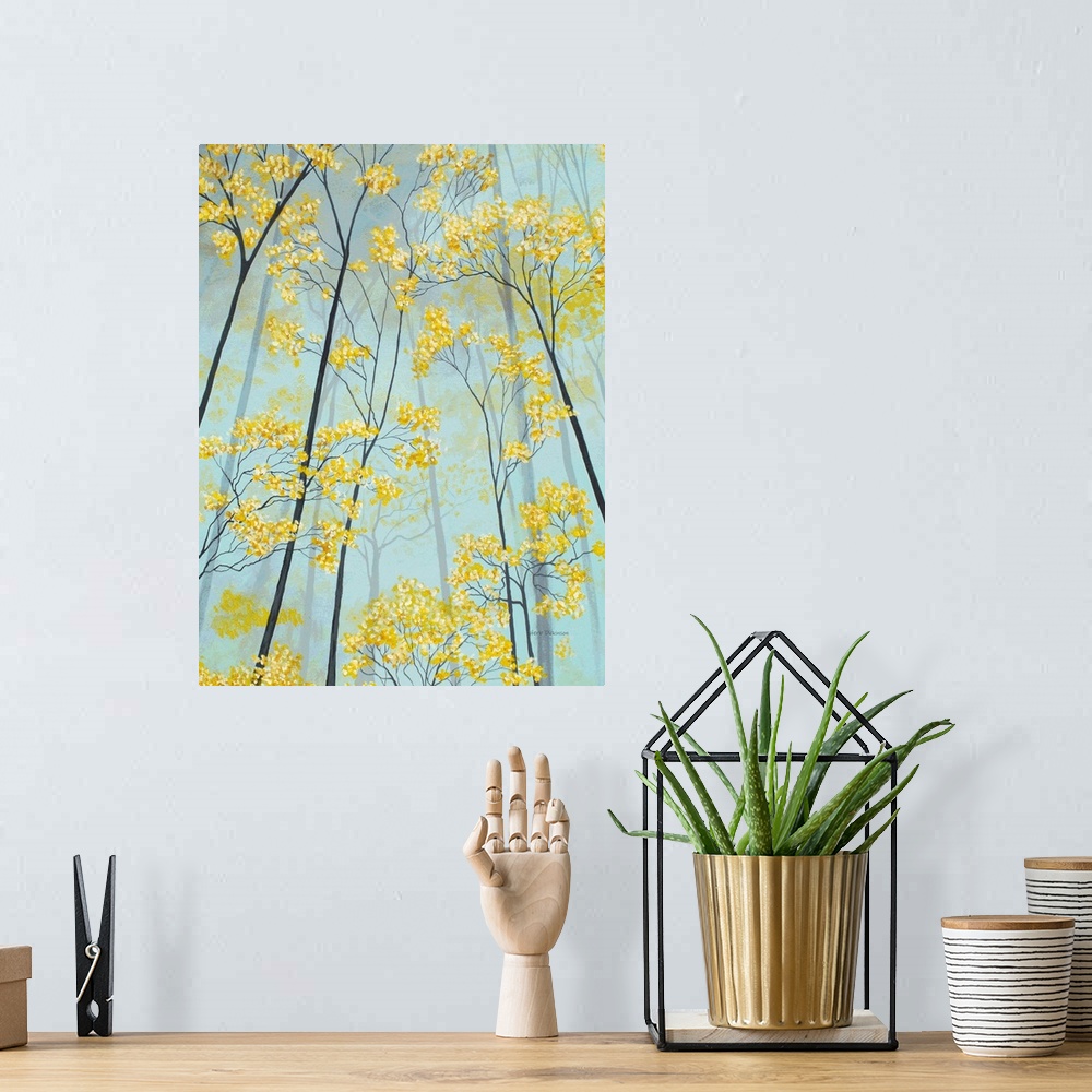 A bohemian room featuring Vertical painting of golden tree tops.