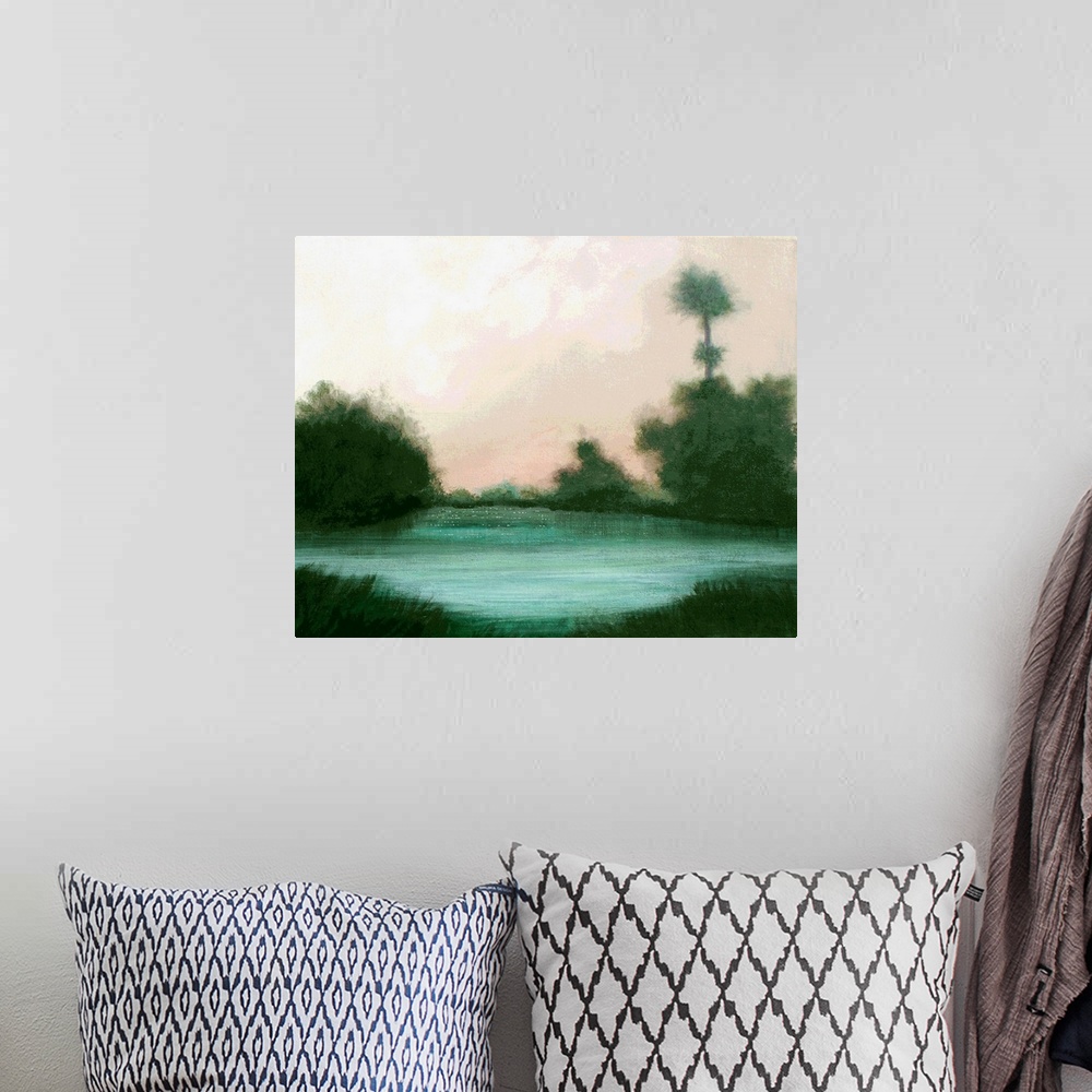 A bohemian room featuring Impressionist painting of a lake landscape with emerald trees surrounding it and a pale pink sky.