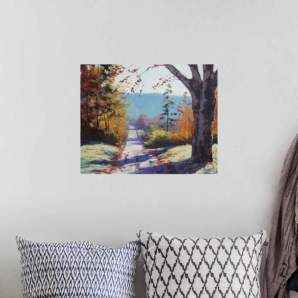 A bohemian room featuring Contemporary painting of an idyllic countryside landscape, with a road cutting through autumn fol...