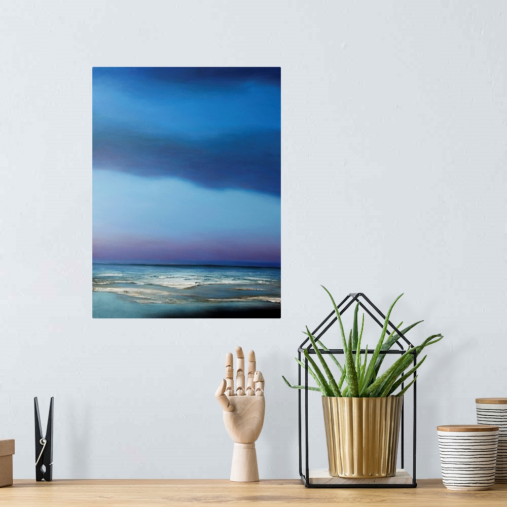 A bohemian room featuring Abstract beachscape at night painted in bright blue hues.