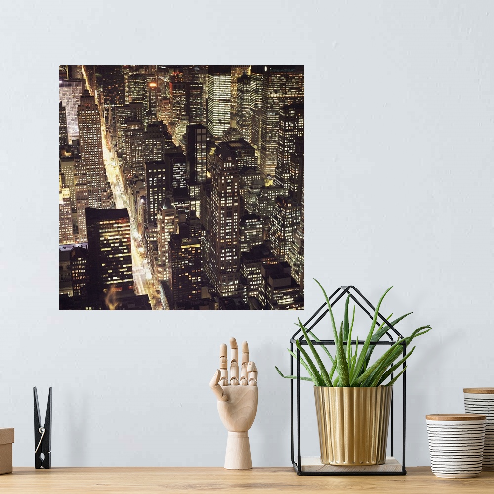 A bohemian room featuring A square image of the cityscape of New York.
