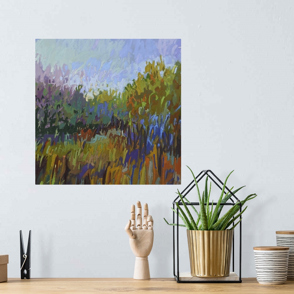 A bohemian room featuring Semi-abstract painting of a grassy field lined with trees.