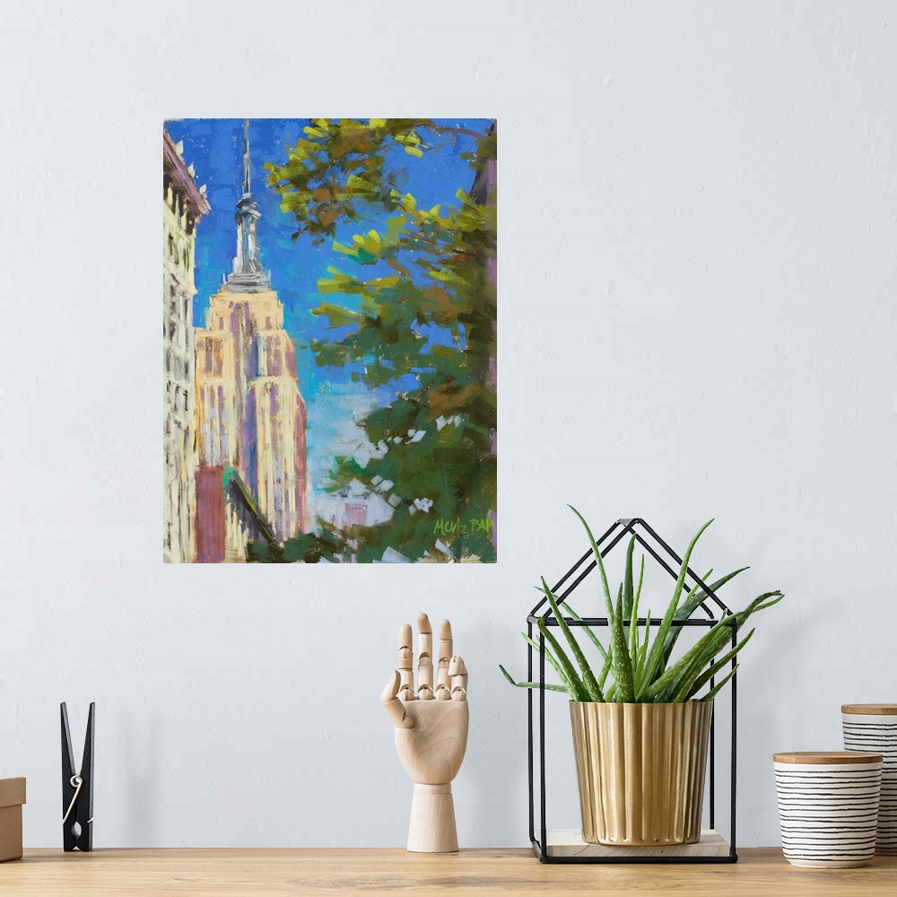 A bohemian room featuring A contemporary painting of the Empire States Building with a tree in the foreground.