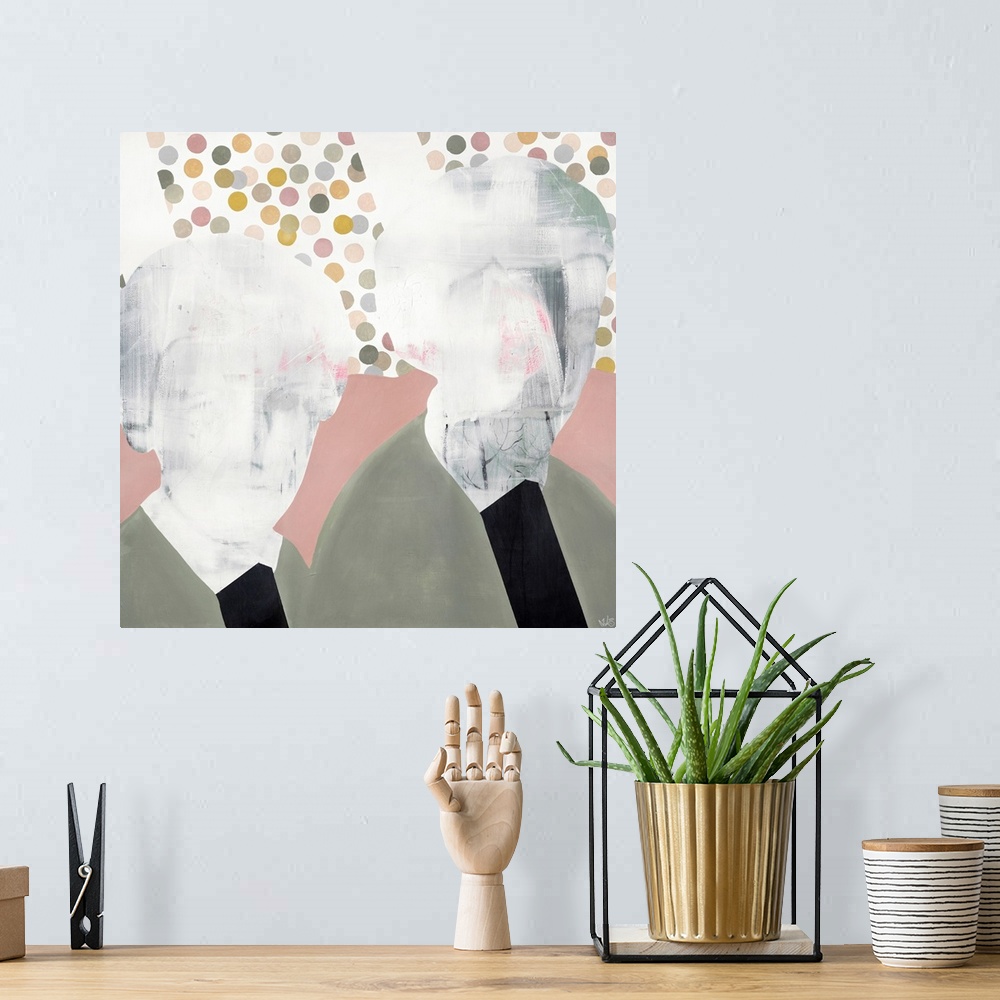 A bohemian room featuring A square modern contemporary portrait of two people with faded detail in their faces.