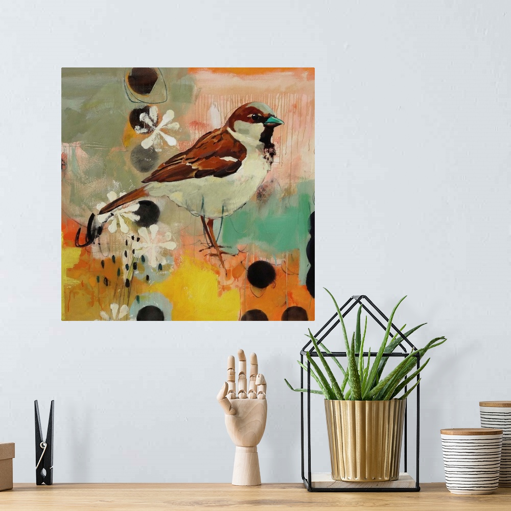 A bohemian room featuring A contemporary painting of a brown and tan bird against a colorful abstract background.