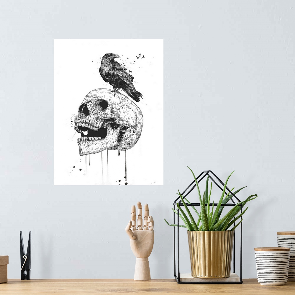 A bohemian room featuring Surrealistic illustration of a raven sitting atop a skull.