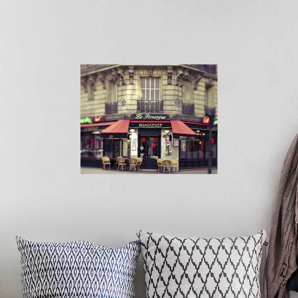 A bohemian room featuring Center focused photograph of a Parisian restaurant.