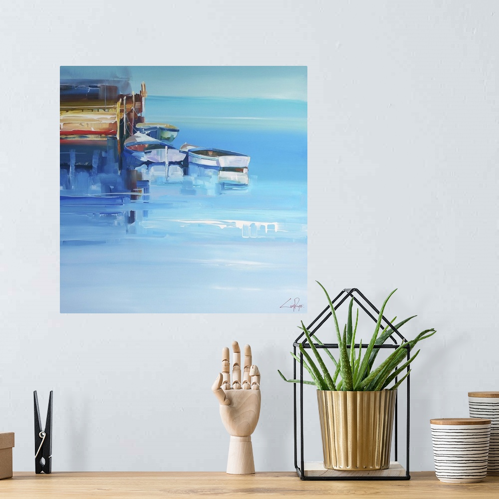 A bohemian room featuring Boats at a wooden dock over deep blue water.