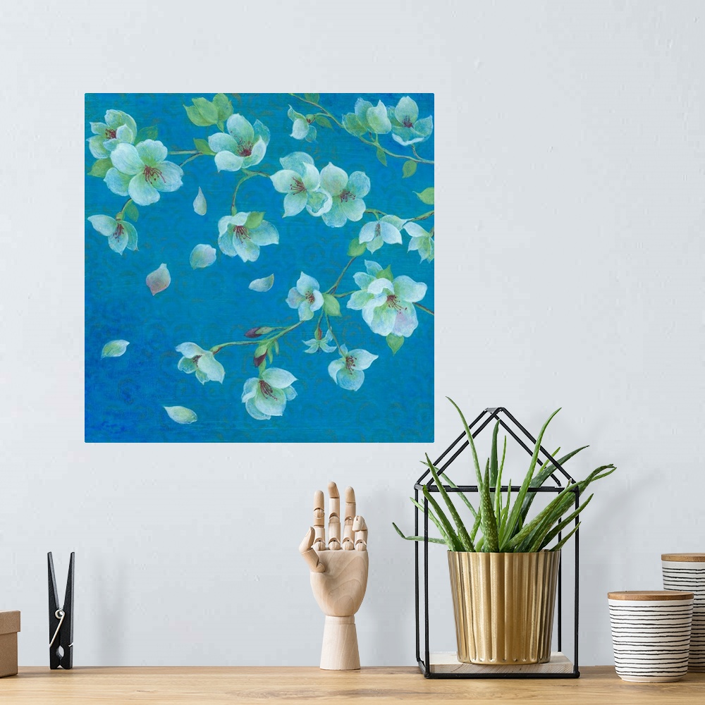 A bohemian room featuring Contemporary artwork of cherry blossoms against a teal blue background.