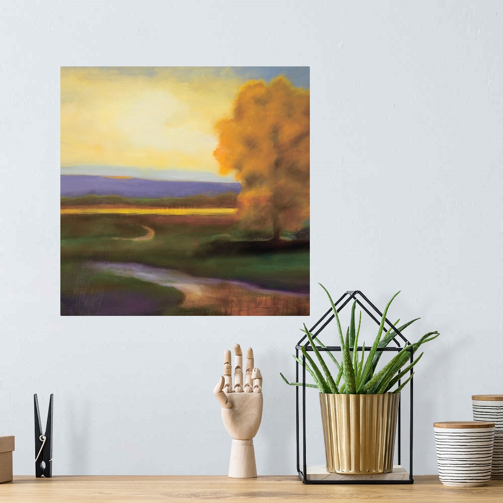 A bohemian room featuring Contemporary painting of golden fall tree on a river in the country.