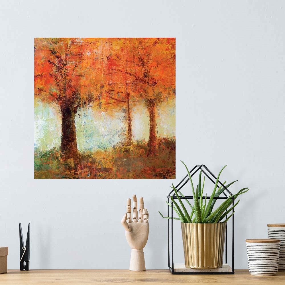 A bohemian room featuring Contemporary artwork of brightly colored fall trees against a soft pale green sky.
