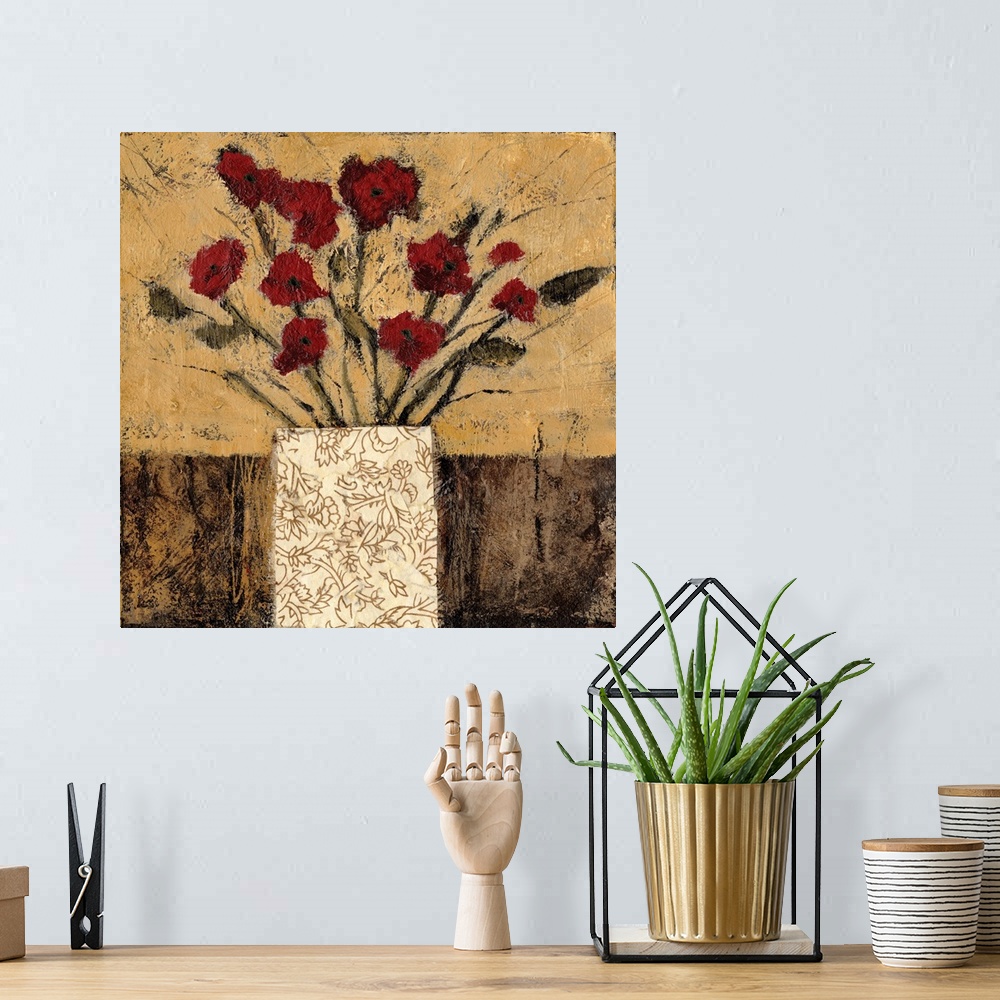 A bohemian room featuring Contemporary artwork of a bouquet of red flowers in a patterned vase.