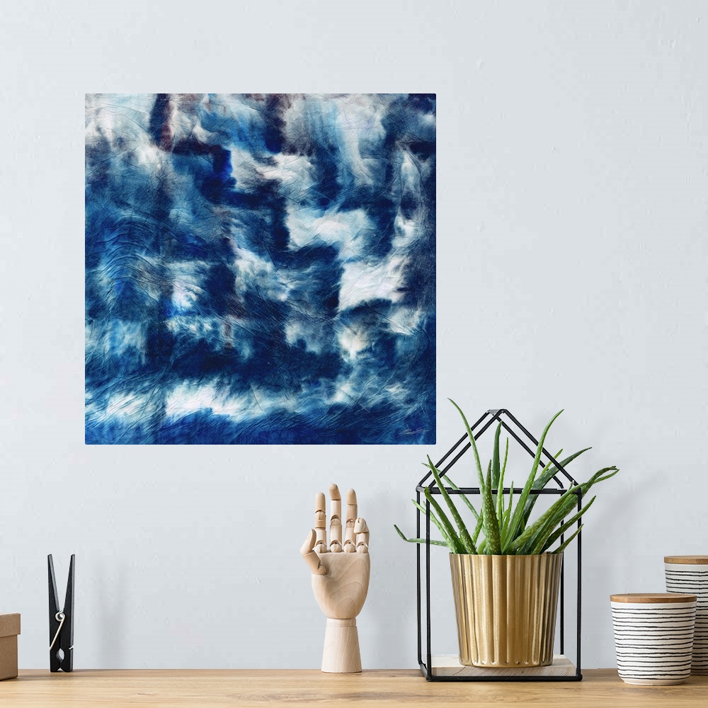 A bohemian room featuring Shibori folds of indigo step across the canvas.
