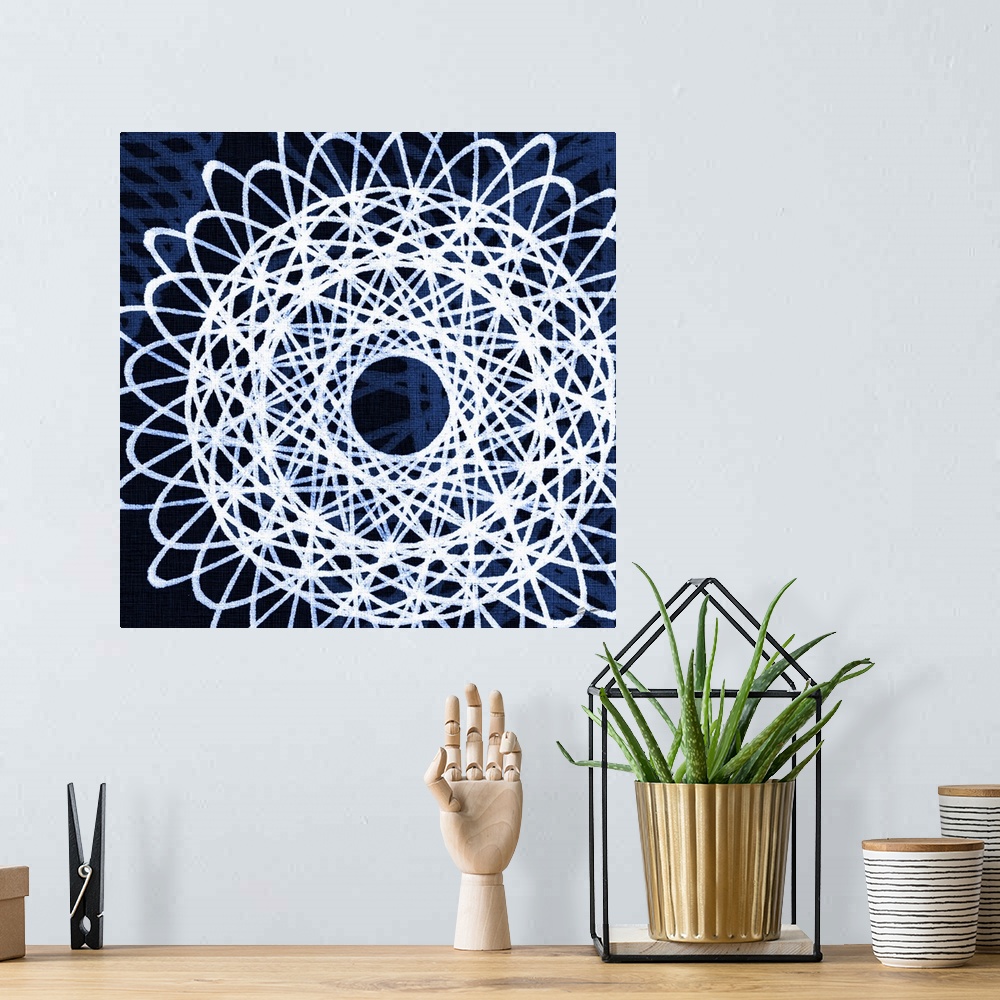 A bohemian room featuring A blueprint of geometric spirals floating on an indigo field.
