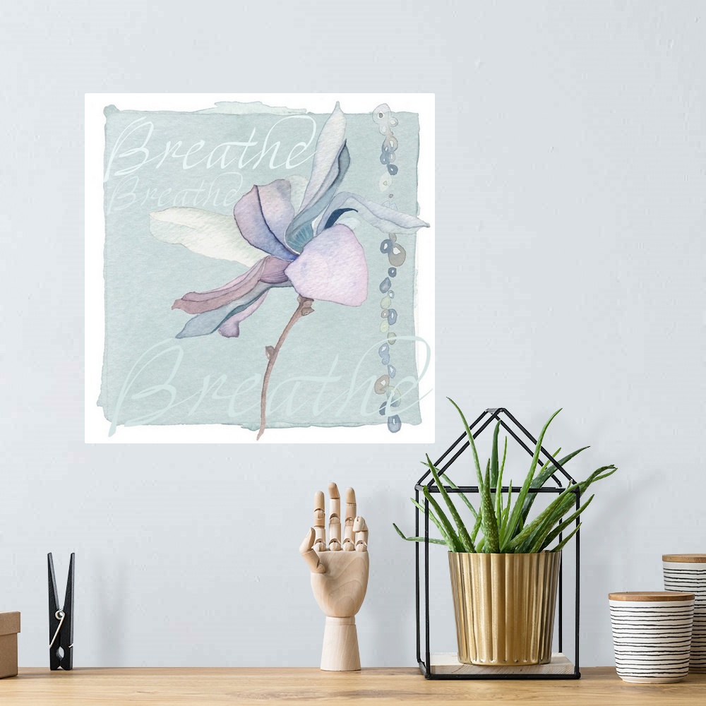 A bohemian room featuring Decorative watercolor painting of a purple lily with the word "Breathe" repeated in the background.