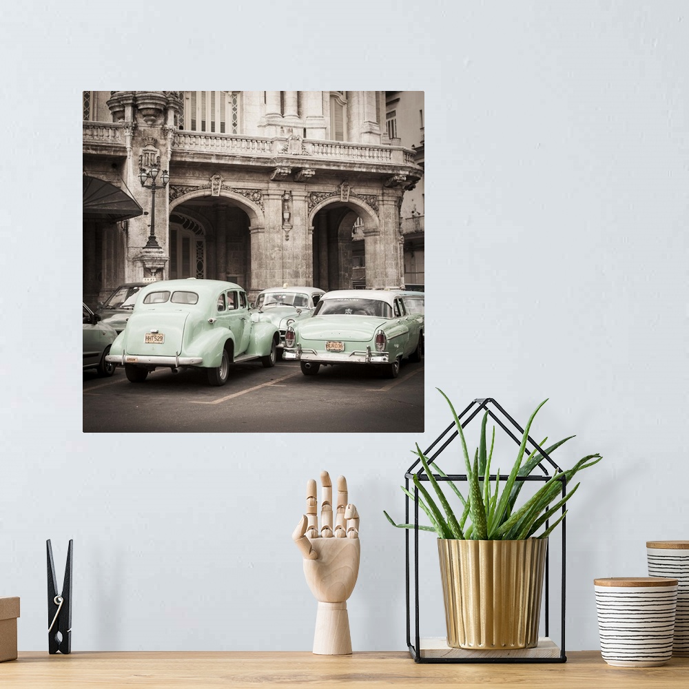 A bohemian room featuring Classic American Cars in front of the Gran Teatro, Parque Central, Havana, Cuba