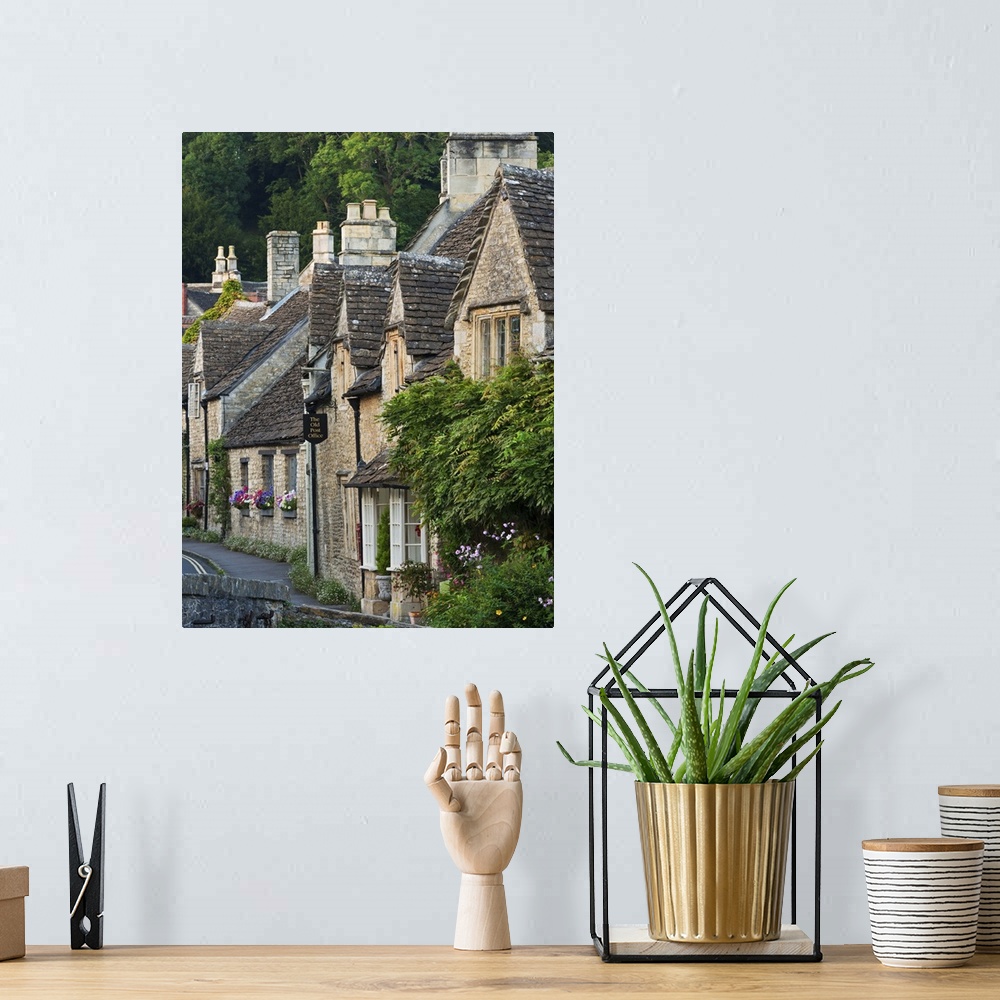 A bohemian room featuring Picturesque cottages in the beautiful Cotswolds village of Castle Combe, Wiltshire, England. Autu...