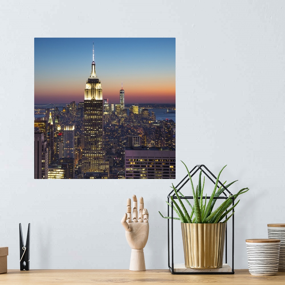 A bohemian room featuring Empire State Building (One World Trade Center behind), Manhattan, New York City, New York, USA.