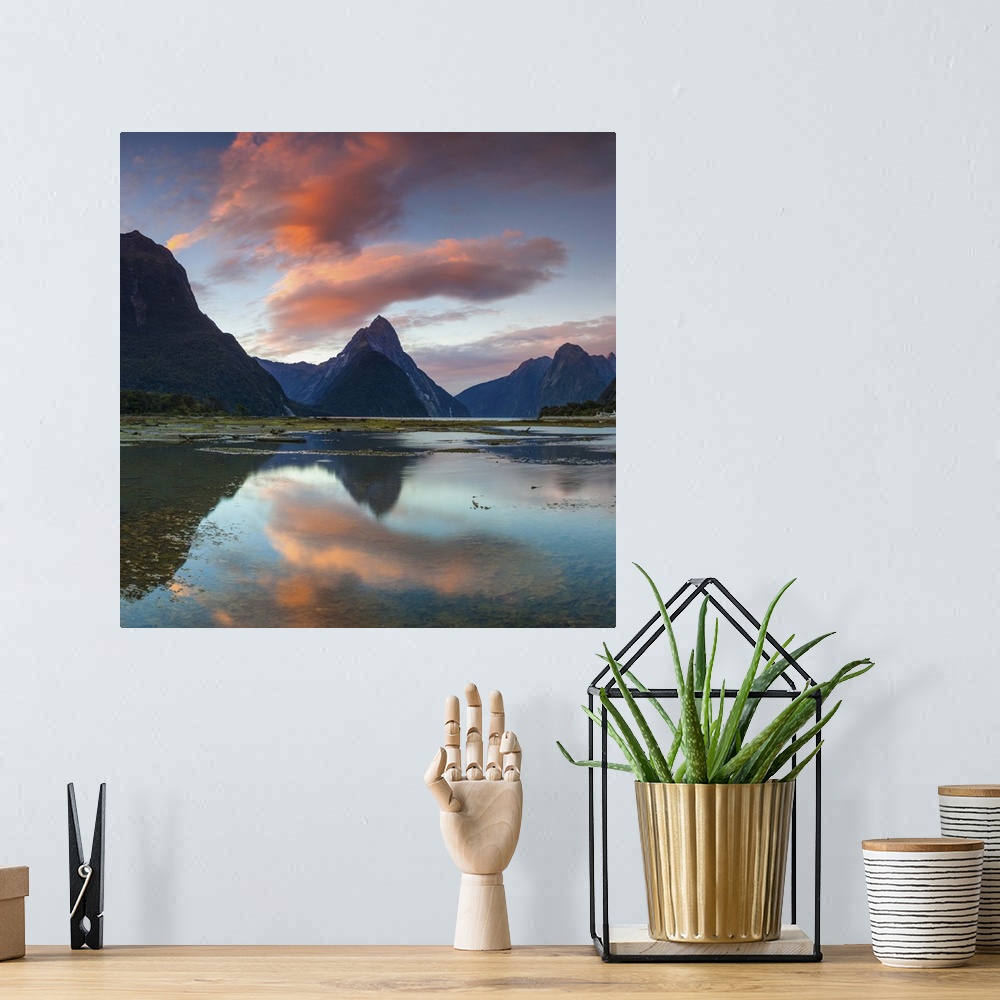A bohemian room featuring The dramatic Mitre Peak illuminated at sunset, Milford Sound, Fiordland, South Island, New Zealand