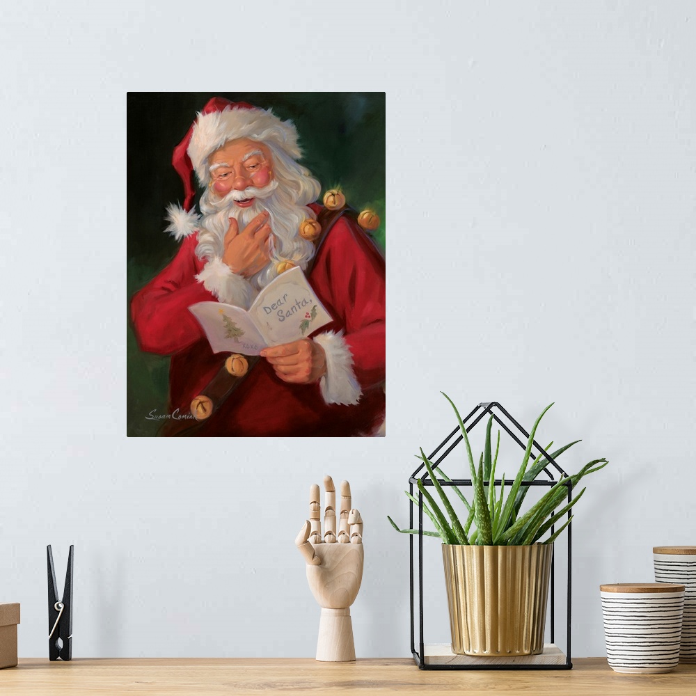 A bohemian room featuring Painting of Santa Claus smiling while reading a note.